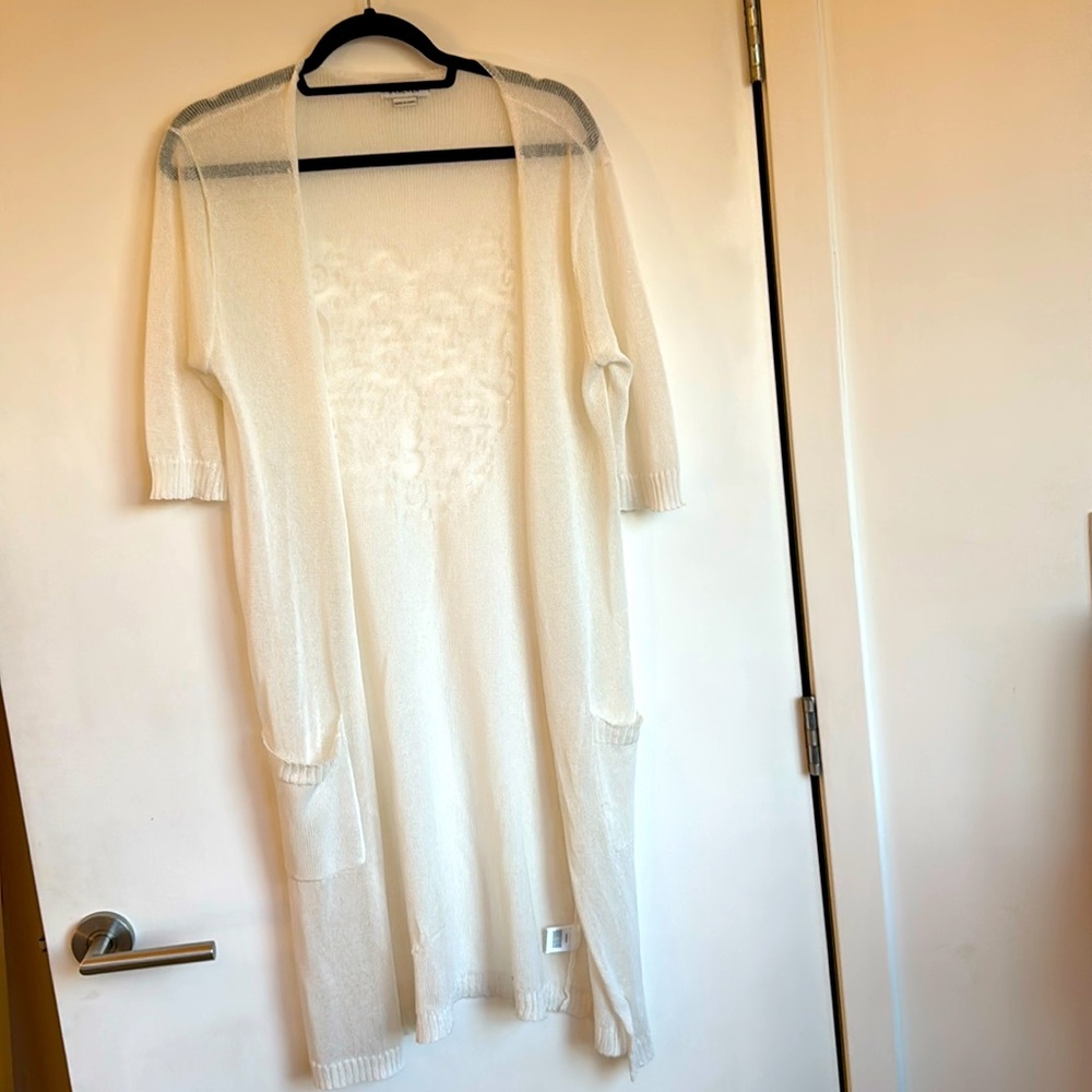 Long ivory sheer sweater with short sleeves.